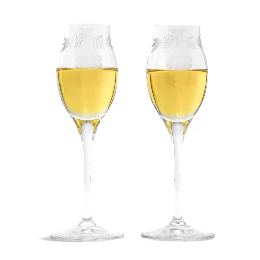 Elegant grappa glass for tasting with bunch of grapes